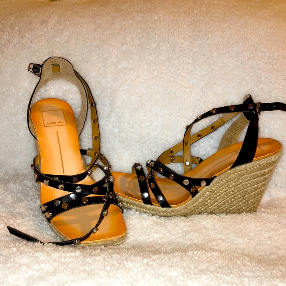 Wedge black and tan crossover ankle shoes.